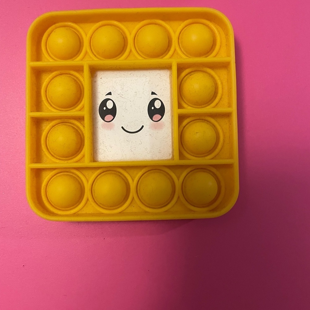 Source Unknown Yellow Smiley Pop It Toy